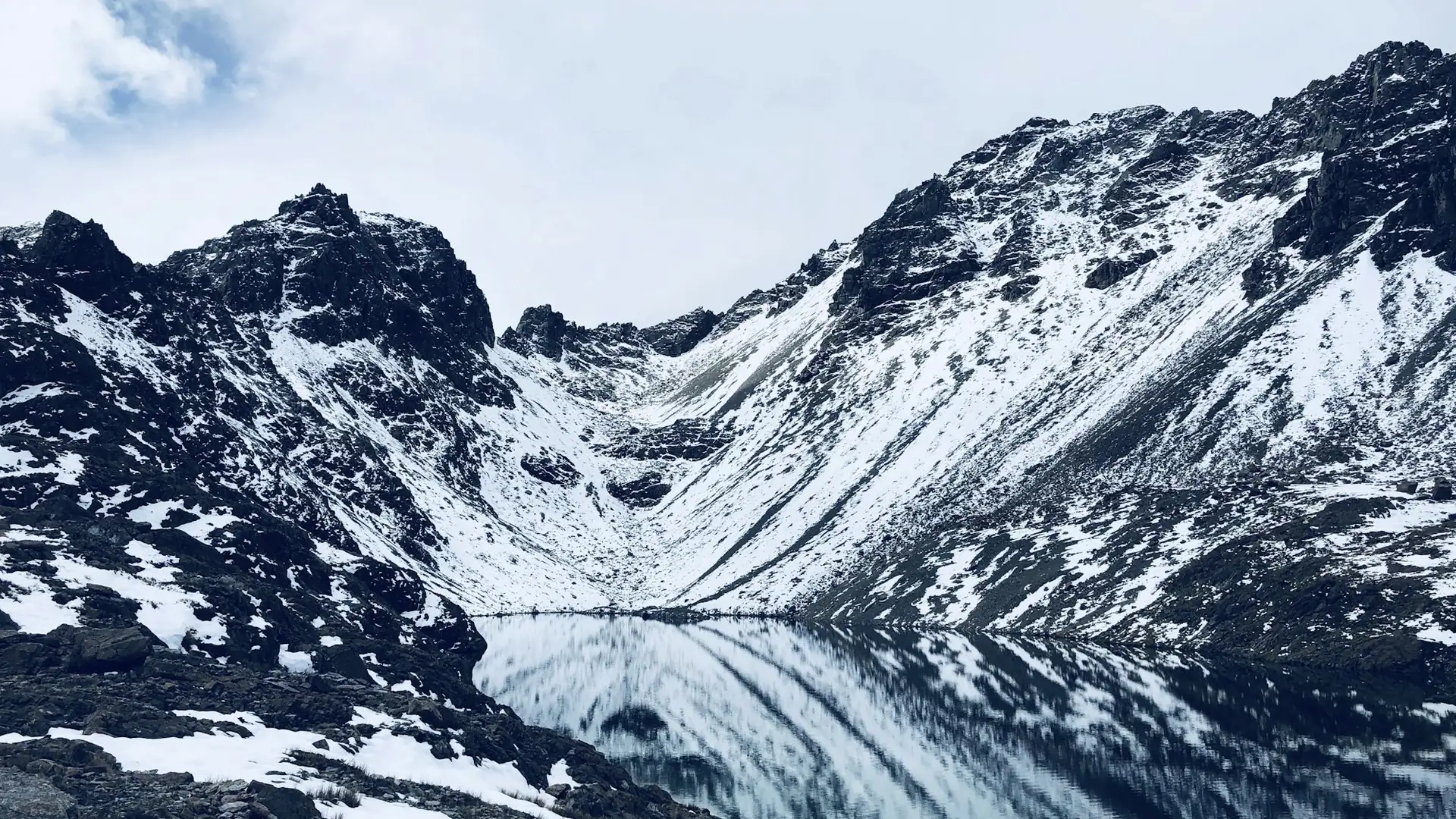 The tarn, half frozen